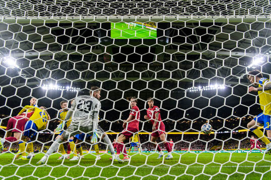 Goalkeeper Kristoffer Nordfeldt sees Victor Nilsson