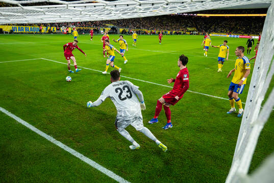 Karol Swiderski of Poland scores the 2-2 goal behind