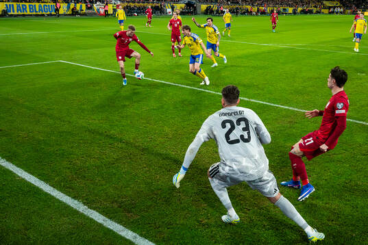 Karol Swiderski of Poland scores the 2-2 goal behind
