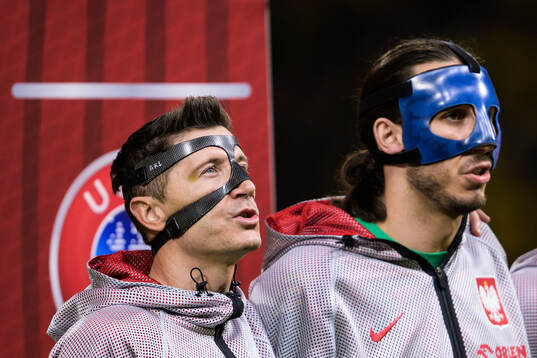Robert Lewandowski and goalkeeper Kamil Grabara of Poland