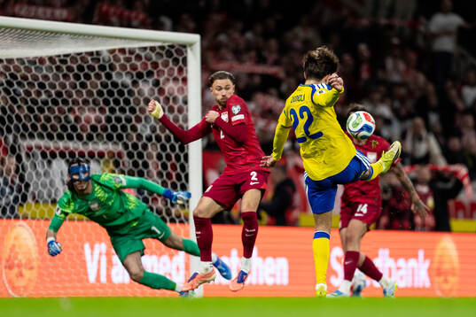 Besfort Zeneli of Sweden shoots the ball in the goal post