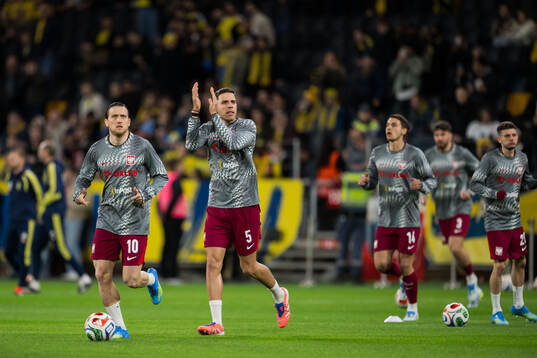 Piotr Zielinski and Jan Bednarek of Poland