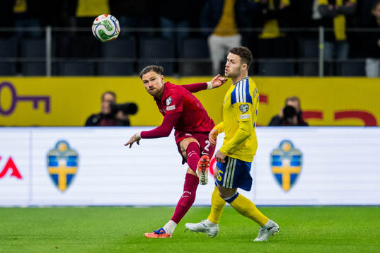 Matty Cash of Poland and Gabriel Gudmundsson of Sweden