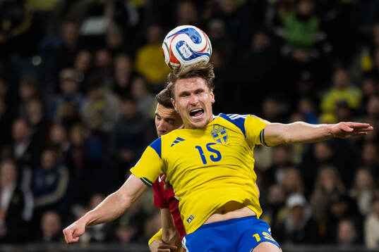 Jan Bednarek of Poland and Carl Starfelt of Sweden