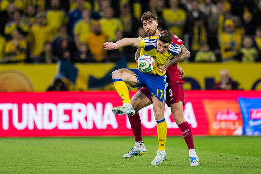 Viktor Gyökeres of Sweden and Przemyslaw Wisniewski of