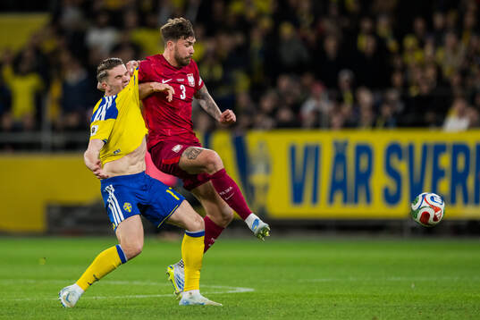 Viktor Gyökeres of Sweden and Przemyslaw Wisniewski of