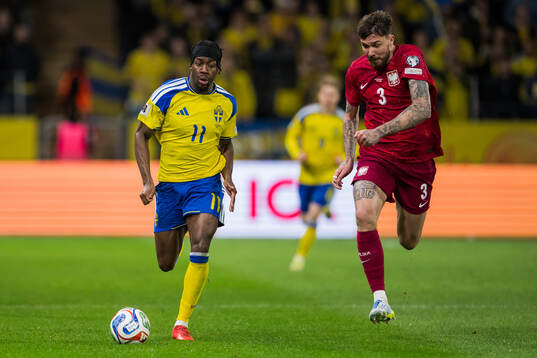 Anthony Elanga of Sweden and Przemyslaw Wisniewski of Poland