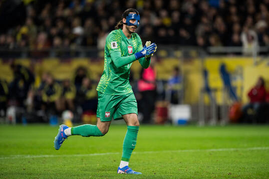 Goalkeeper Kamil Grabara of Poland celebrates