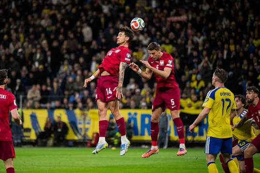 Jakub Kiwior and Jan Bednarek of Poland