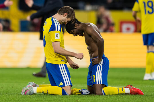Benjamin Nygren and Anthony Elanga of Sweden celebrate