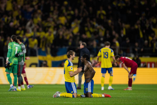 Benjamin Nygren and Anthony Elanga of Sweden celebrate