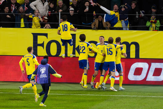 Viktor Gyökeres of Sweden celebrates with teammates