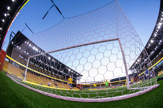 Noah Tolf and goalkeeper Elis Bishesari of Sweden look
