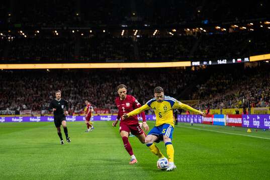 Matty Cash of Poland and Gabriel Gudmundsson of Sweden
