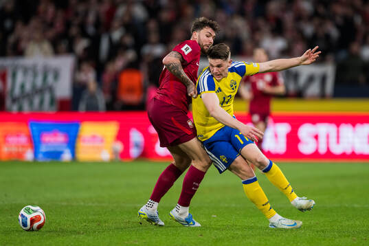 Przemyslaw Wisniewski of Poland and Viktor Gyökeres of