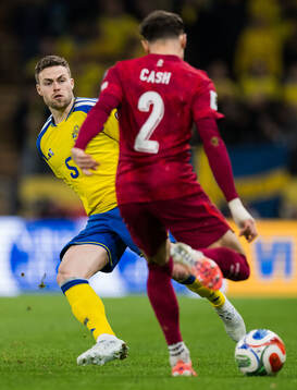 Gabriel Gudmundsson of Sweden and Matty Cash of Poland