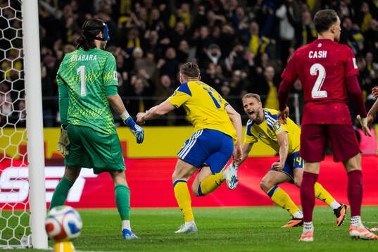Viktor Gyökeres and Gustav Lundgren of Sweden celebrate