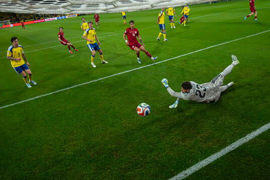 Goalkeeper Kristoffer Nordfeldt of Sweden lets in the 1-1