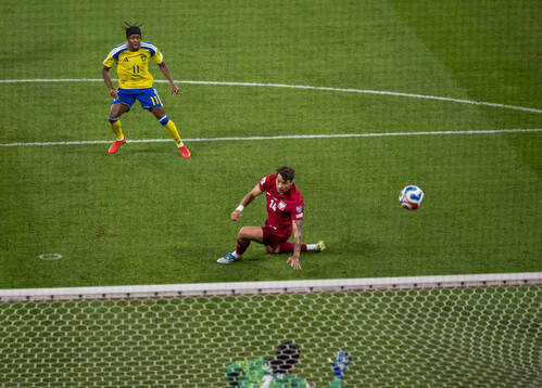 Anthony Elanga of Sweden scores the 1-0 goal