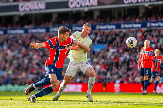 Alexander Sørloth of Norway and Nico Elvedi of Switzerland