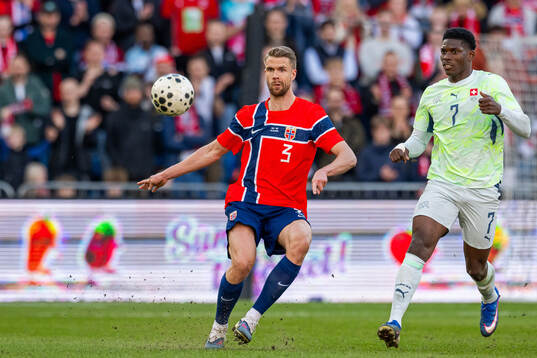 Kristoffer Ajer of Norway and Breel Embolo of Switzerland