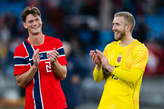Henrik Falchener and goalkeeper Egil Selvik of Norway