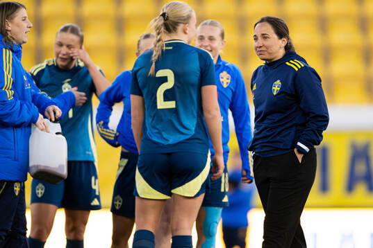 Coach Briana Campos of Sweden celebrates