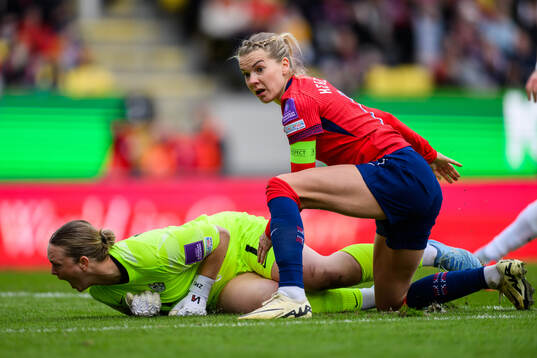 goalkeeper Zala Mersnik of Slovenia and Ada Hegerberg of