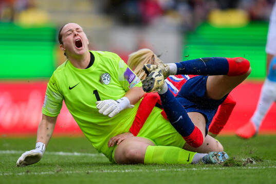 goalkeeper Zala Mersnik of Slovenia and Ada Hegerberg of