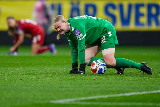 goalkeeper Freja Thisgaard of Denmark in pain
