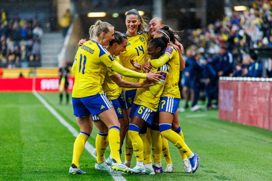 Monica Jusu Bah of Sweden celebrates with teammates