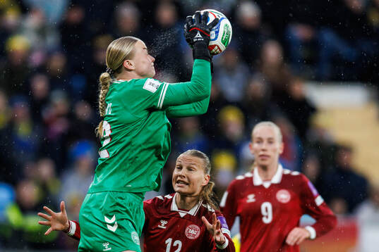 goalkeeper Freja Thisgaard ans Stine Sandbech of Denmark