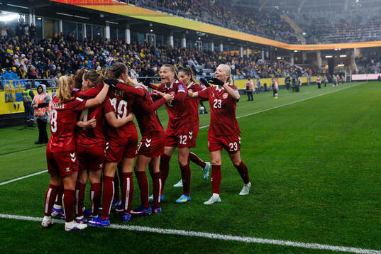 Janni Thomsen of Denmark celebrates with team mates