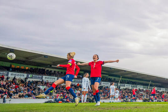 Ada Hegerberg and Ingrid Syrstad Engen of Norway celebrate