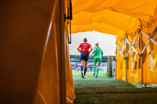 Ingrid Syrstad Engen and goalkeeper Cecilie Fiskerstrand of