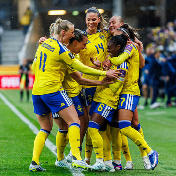Monica Jusu Bah of Sweden celebrates with teammates