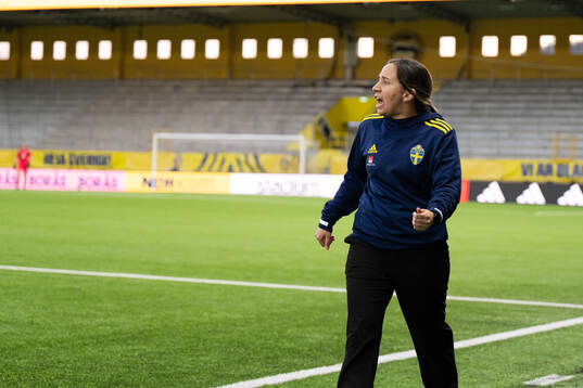 Coach Briana Campos of Sweden celebrate