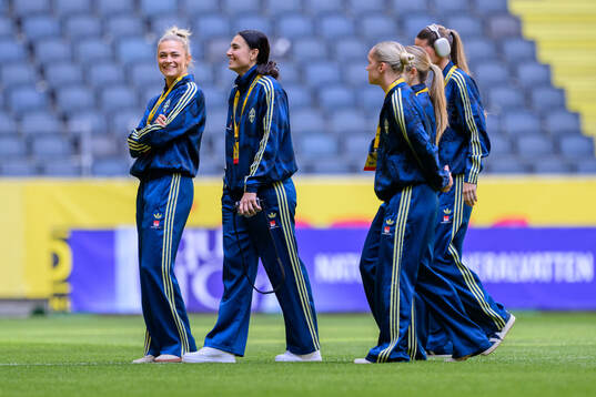 Fridolina Rolfö and goalkeeper Zecira Musovic of Sweden