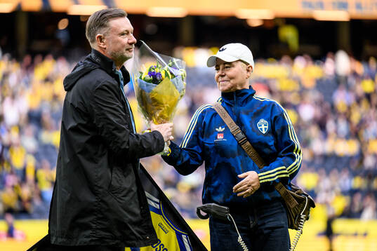 Former coach Peter Gerhardsson and Marika Domanski Lyfors