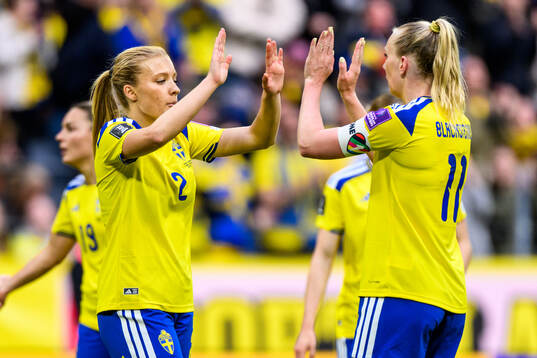 Smilla Holmberg and Stina Blackstenius of Sweden celebrate