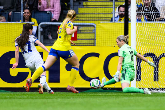 Sara Stokic of Serbia and goalkeeper Jennifer Falk of Sweden