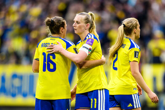 Filippa Angeldahl and Stina Blackstenius of Sweden celebrate