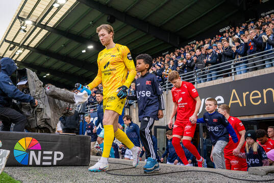 Goalkeeper Mathias Dyngeland of Brann enters the pitch