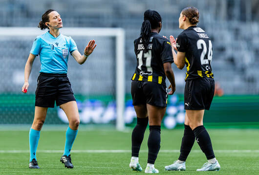 Referee Silvia Gasperotti talking to Monica Jusu Bah and