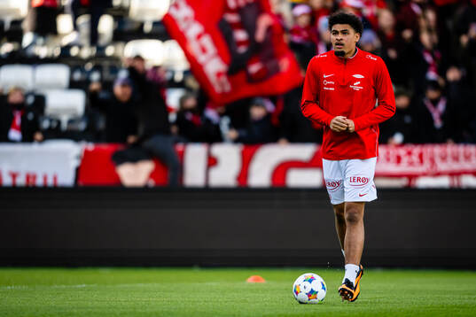 Noah Jean Holm of Brann warms up