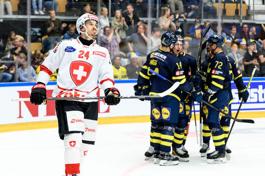 Tobias Geisser of Switzerland looks dejected