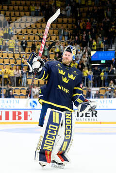 Goaltender Magnus Hellberg of Sweden celebrates