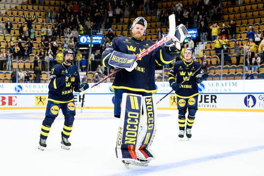 Goaltender Magnus Hellberg of Sweden celebrates