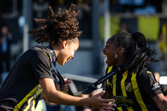 Felicia Schröder and Monica Jusu Bah celebrate