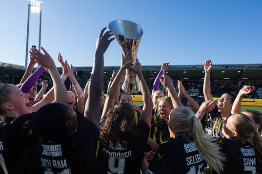 Players of Häcken celebrate with the trophy
